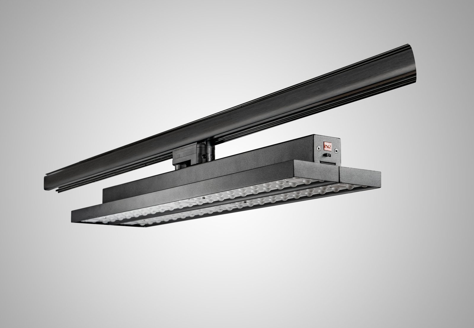 Side perspective of dual-panel LED track linear light showing two long optical panels
